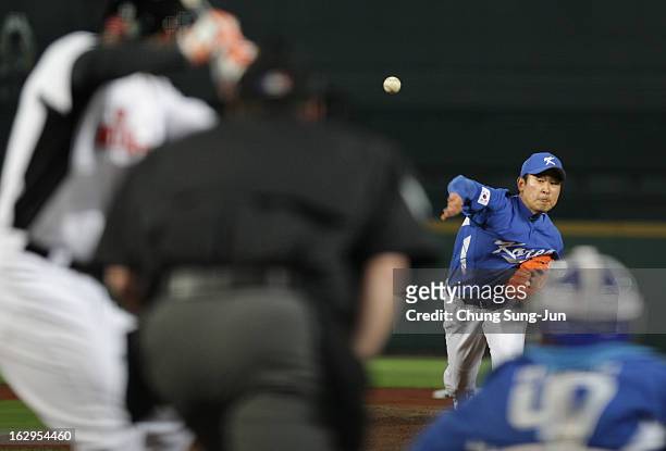 Yoon Suk-Min of South Korea pitchs in the top of first inning during the World Baseball Classic First Round Group B match between South Korea and the...