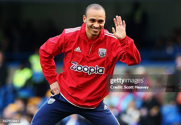 Peter Odemwingie of West Bromwich Albion waves as he warms up prior to the Barclays Premier League match between Chelsea and West Bromwich Albion at...