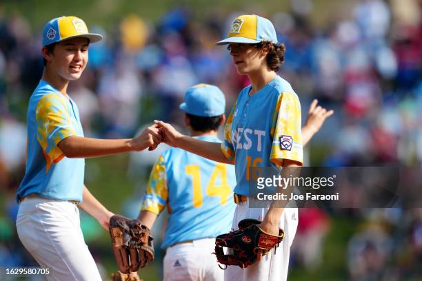 Louis Lappe and Ollie Parks of the West Region team from El Segundo, California fist bump during the Little League World Series Championship Game...