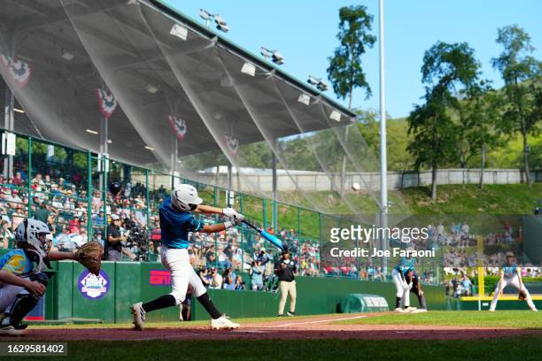 Juan Cleto Ferreras of the Caribbean Region team from Willemstad, Curacao hits a home run during the Little League World Series Championship Game...