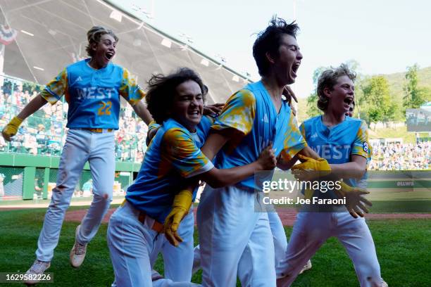 Louis Lappe of the West Region team from El Segundo, California celebrates with teammates after hitting a walk off home run to beat the Caribbean...