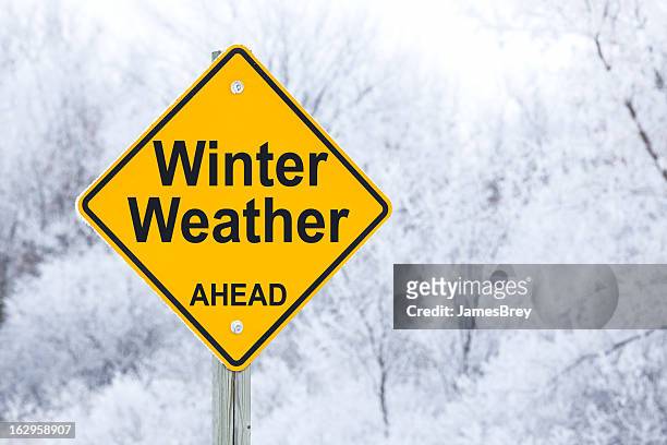 winter weather ahead road sign - weather stock pictures, royalty-free photos & images