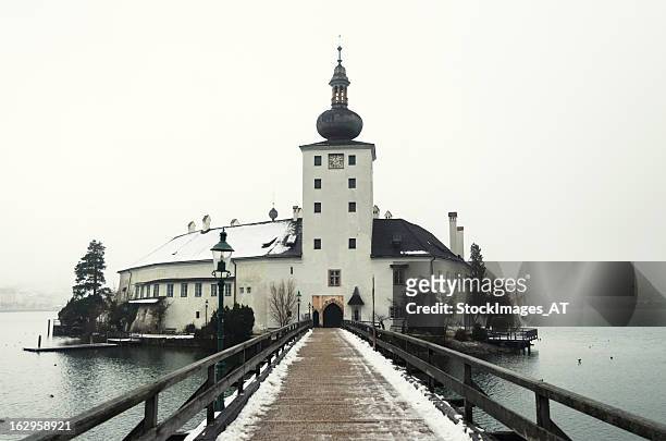 bridge to seeschloss ort - gmunden austria stock pictures, royalty-free photos & images