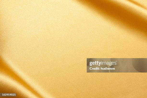 gold satin background textured - shiny fabric stock pictures, royalty-free photos & images