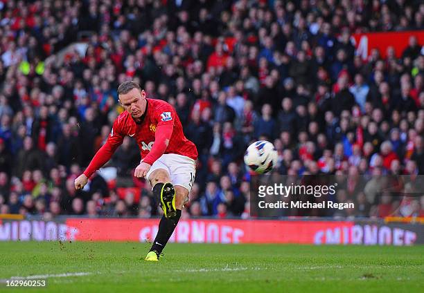 Wayne Rooney of Manchester United scores to make it 4-0 during the Barclays Premier League match between Manchester United and Norwich City at Old...