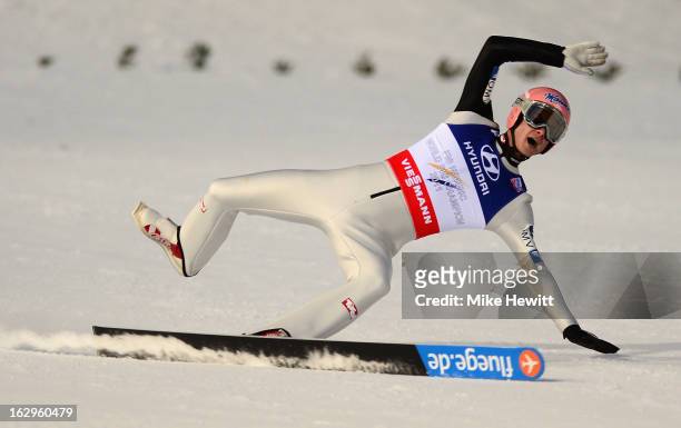 Manuel Fettner of Austria loses a ski during the Men's Ski Jumping Team HS134 Final Round at the FIS Nordic World Ski Championships on March 2, 2013...