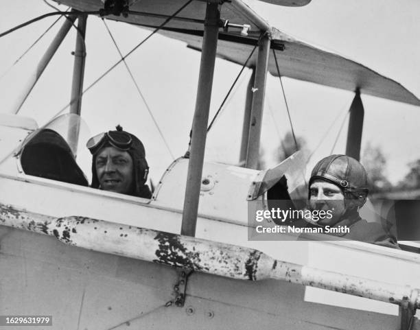 Year old John Lipton with Captain Bannister, piloting a plane at Loughton Air Park, Abridge, Essex, circa 1933. John Lipton had 200 hours flying...