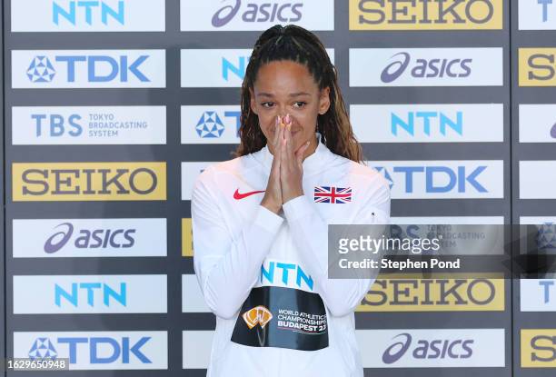 Gold medalist Katarina Johnson-Thompson of Team Great Britain celebrates on the podium after the Heptathlon Final during day three of the World...