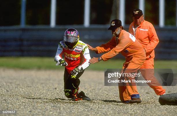 Luis d''Antin of Spain gets a helping hand from the stewards after crashing during the Czech Republic Grand Prix at the Brno circuit in the Czech...