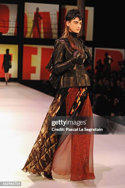 Model walks the runway during the Jean-Paul Gaultier Fall/Winter 2013 Ready-to-Wear show as part of Paris Fashion Week on March 2, 2013 in Paris,...