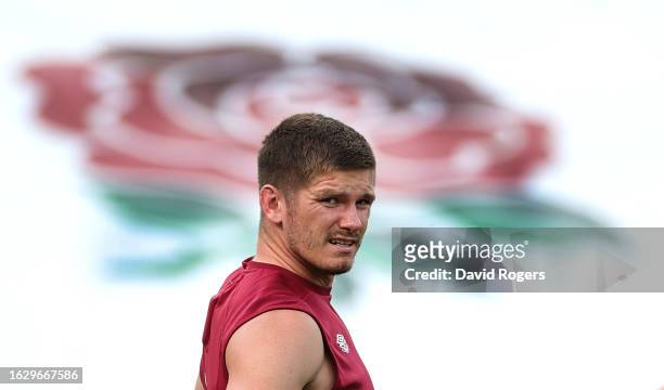 Owen Farrell, the England captain looks on during the England training session held at Pennyhill Park on August 21, 2023 in Bagshot, England.