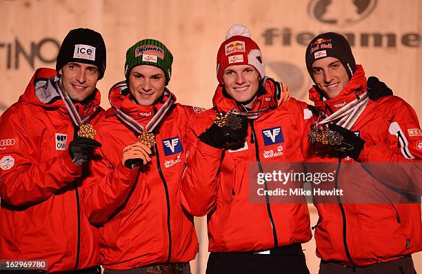 Gregor Schlierenzauer, Wolfgang Loitzl, Manuel Fettner and Thomas Morgenstern of Austria celebrate with their Gold medals at the medal ceremony for...