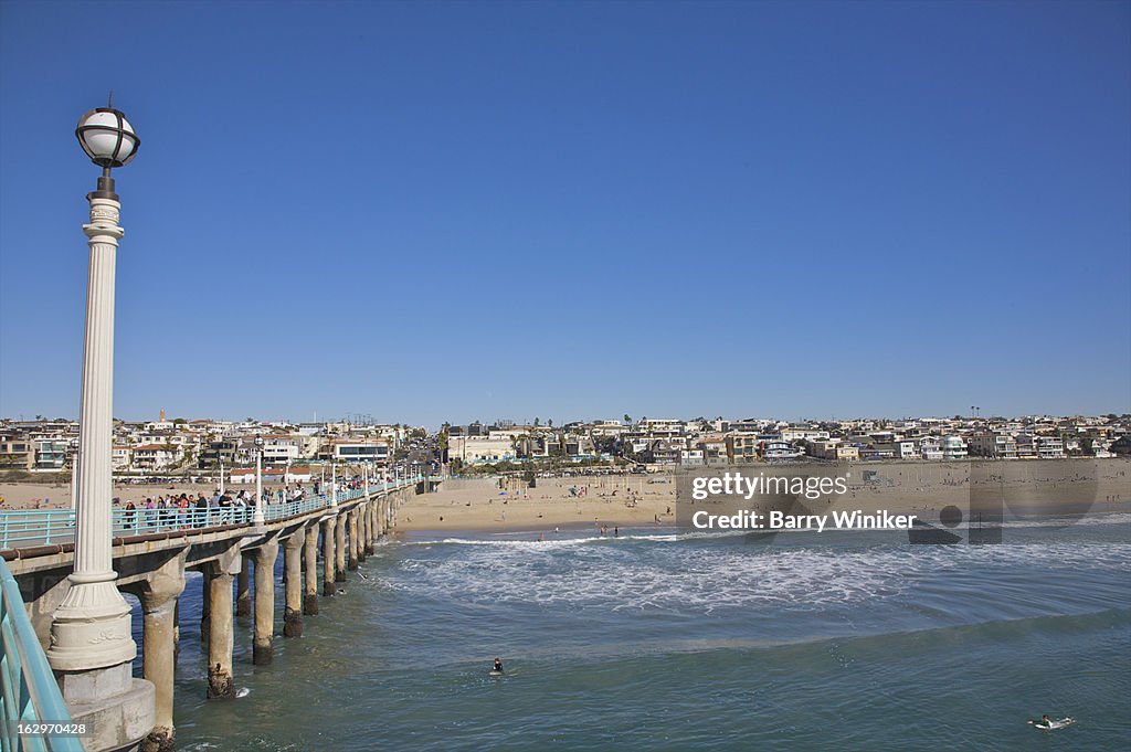 Blue waters near pier, shore and sky