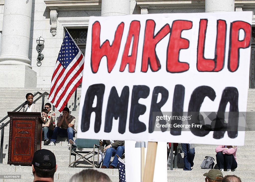 Gun Rights Parade Gun rights supporters hold signs and listen to former Republican ...