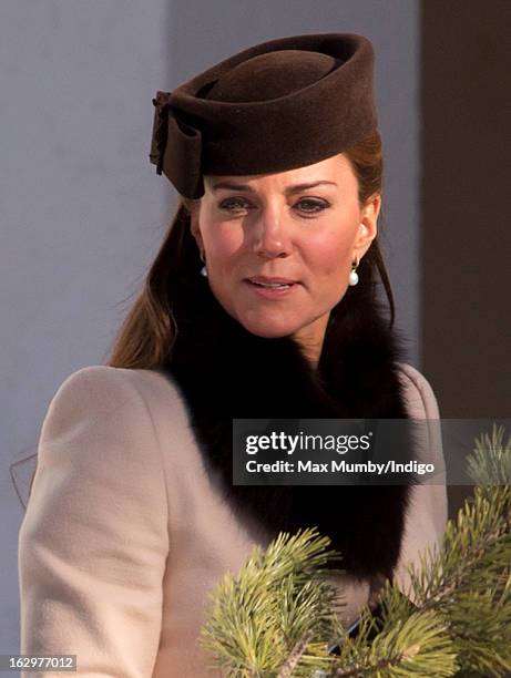 Catherine, Duchess of Cambridge attends the wedding of Laura Bechtolsheimer and Mark Tomlinson at the Protestant Church on March 2, 2013 in Arosa,...