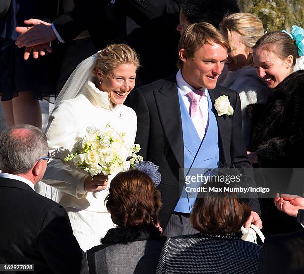 Laura Bechtolsheimer and Mark Tomlinson leave the Protestant Church after their wedding on March 2, 2013 in Arosa, Switzerland.