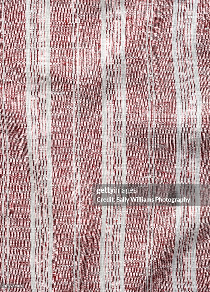 A red tripped linen cloth background