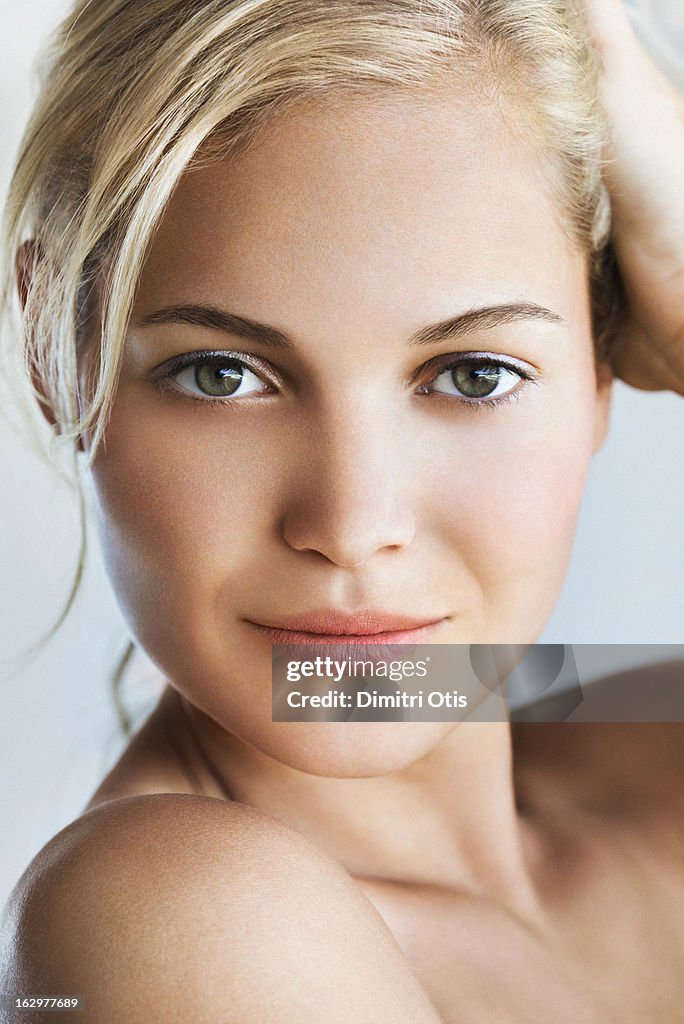 Beauty portrait of young blond woman, close-up