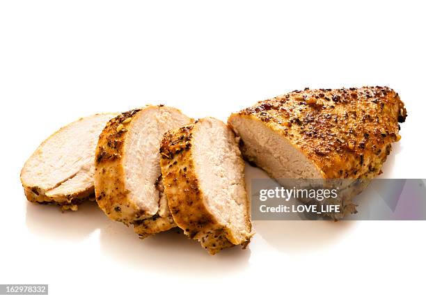 sliced grilled and seasoned chicken breast - grilled chicken stock pictures, royalty-free photos & images
