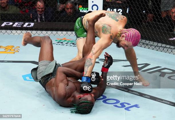 Sean O'Malley knocks out Aljamain Sterling in the UFC bantamweight championship fight during the UFC 292 event at TD Garden on August 19, 2023 in...