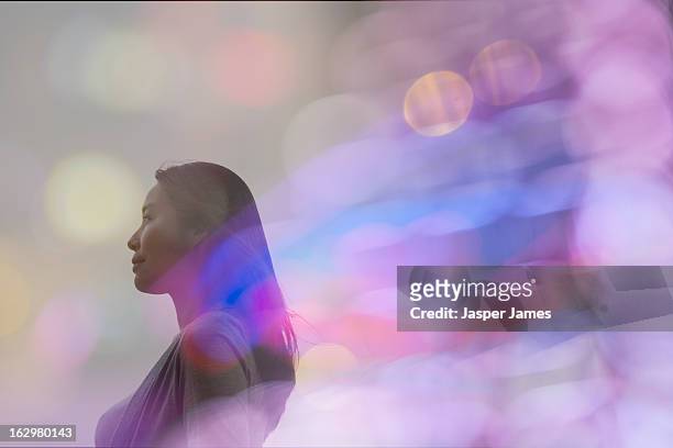 double exposure of woman and lights - blendenfleck stock-fotos und bilder