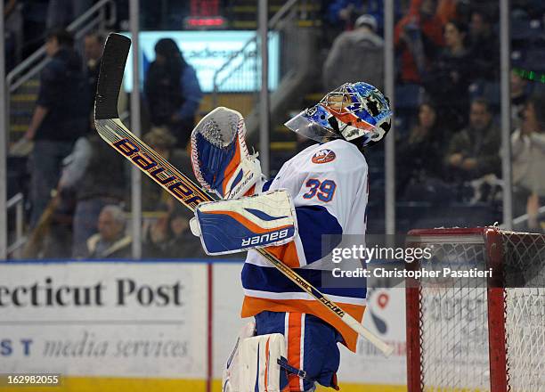 Rick DiPietro of the Bridgeport Sound Tigers reacts after defeating the Adirondack Phantoms during an American Hockey League on March 2, 2013 at the...