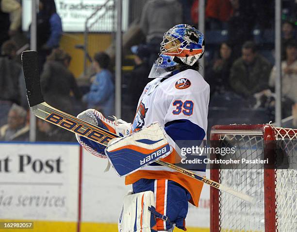 Rick DiPietro of the Bridgeport Sound Tigers reacts after defeating the Adirondack Phantoms during an American Hockey League on March 2, 2013 at the...