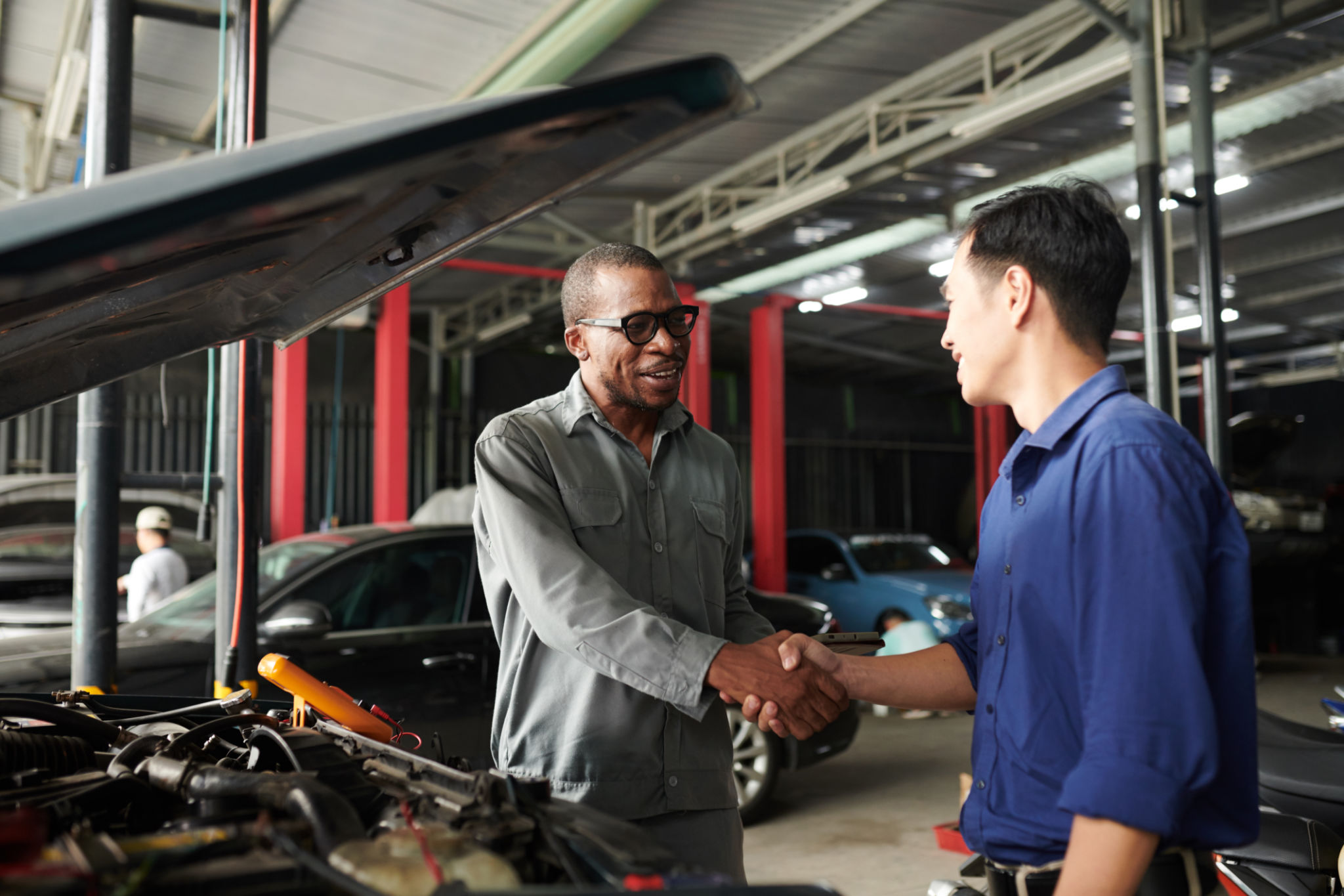 mechanic talking to customer