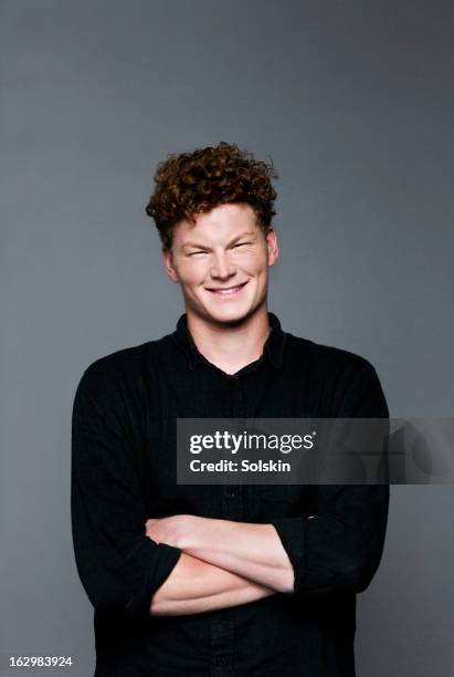 portrait of young man, studio background - black shirt stock pictures, royalty-free photos & images