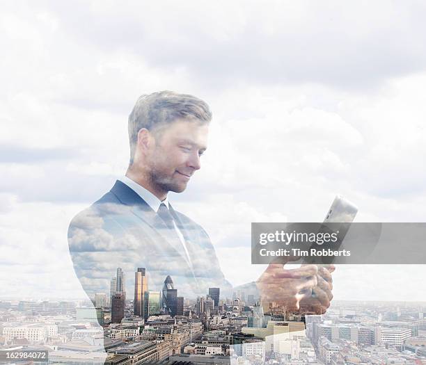 business man using tablet with london view. - clouds transparent stock pictures, royalty-free photos & images