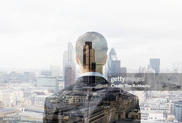 business man looking towards the city. - double exposure business stockfoto's en -beelden