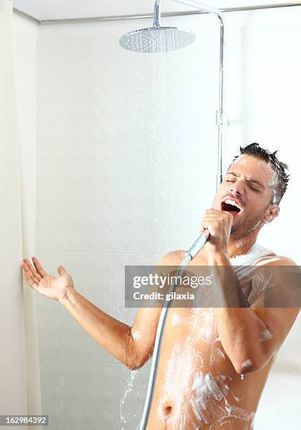 singing under shower. - singing shower stock pictures, royalty-free photos & images