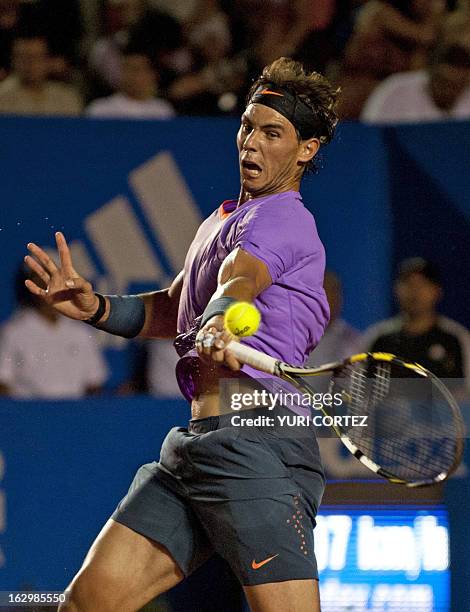 Rafael Nadal of Spain returns the ball to his compatriot David Ferrer during the Mexico ATP Open men's single final in Acapulco, Guerrero state on...