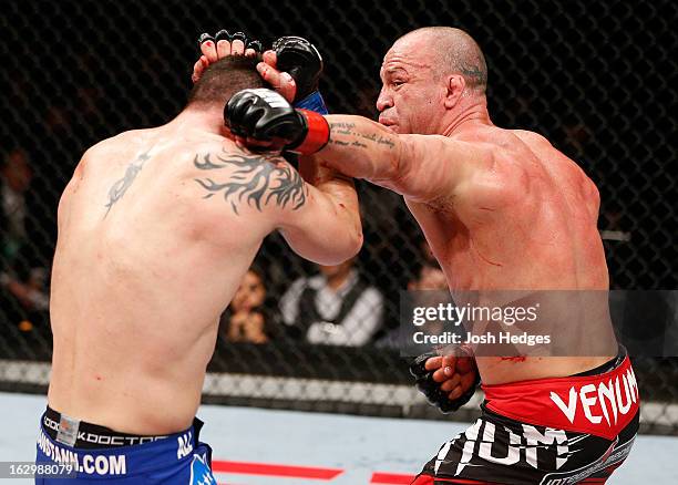 Wanderlei Silva punches Brian Stann in their light heavyweight fight during the UFC on FUEL TV event at Saitama Super Arena on March 3, 2013 in...