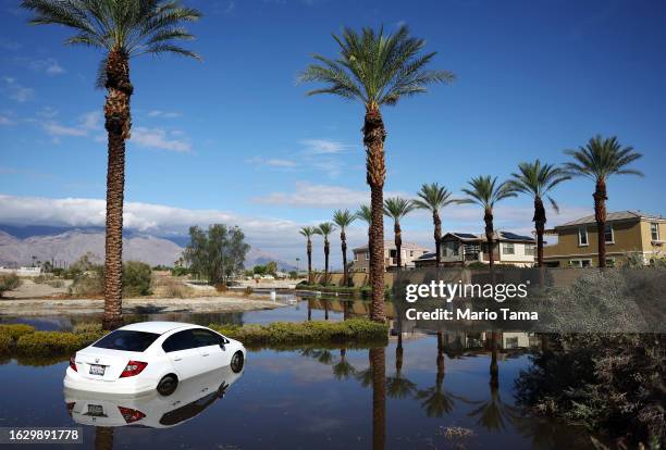 Vehicle is partially submerged in floodwaters after Tropical Storm Hilary moved through the area on August 21, 2023 in Cathedral City, California....