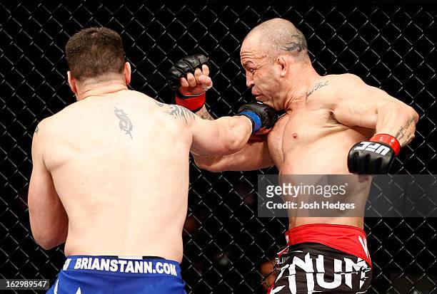 Brian Stann punches Wanderlei Silva in their light heavyweight fight during the UFC on FUEL TV event at Saitama Super Arena on March 3, 2013 in...