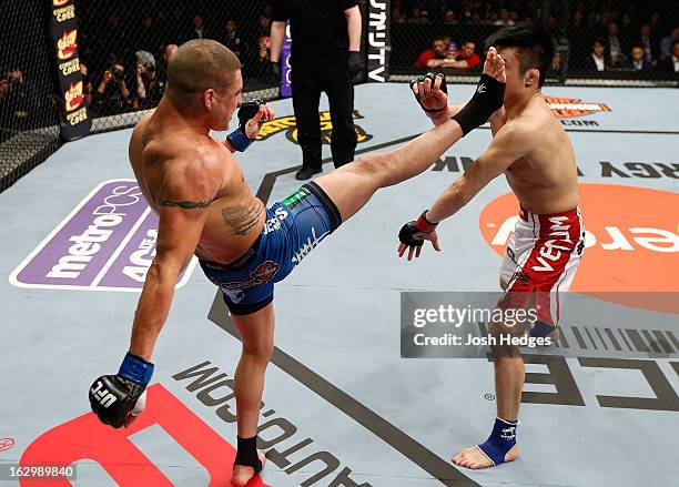Diego Sanchez kicks Takanori Gomi in their lightweight fight during the UFC on FUEL TV event at Saitama Super Arena on March 3, 2013 in Saitama,...