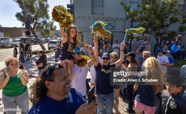 El Segundo, CA Hundreds of El Segundo community members line Main Street with signs and cheers as the El Segundo Little League All Stars arrive home...