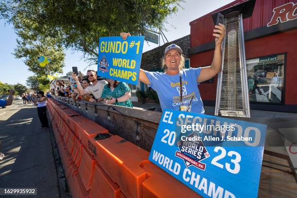 El Segundo, CA Hundreds of El Segundo community members line Main Street with signs and cheers as the El Segundo Little League All Stars arrive home...