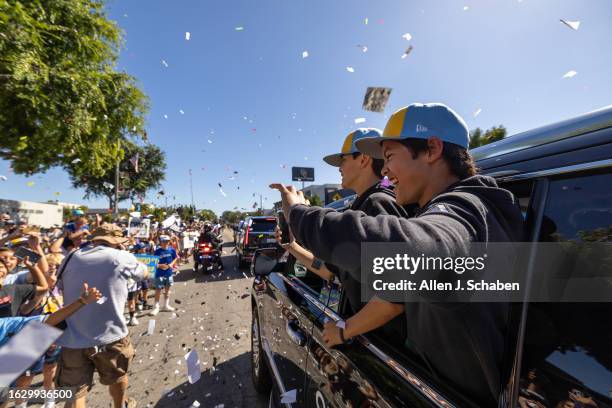 El Segundo, CA El Segundo Little League All Stars players Quinn Boehle, left, and Lennon Salazar celebrate with a large crowd of El Segundo community...