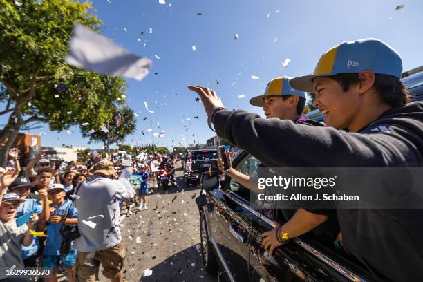 El Segundo, CA El Segundo Little League All Stars players Quinn Boehle, left, and Lennon Salazar celebrate with a large crowd of El Segundo community...