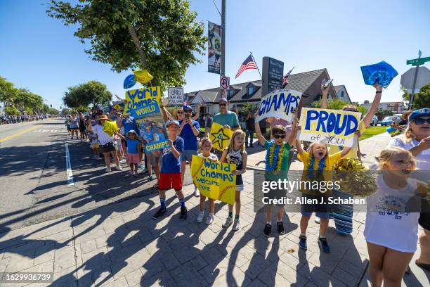 El Segundo, CA Hundreds of El Segundo community members line Main Street with signs and cheers as the El Segundo Little League All Stars arrive home...