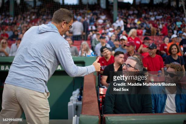 Boston Red Sox President and CEO Sam Kennedy reacts with comedian John Oliver before a game between the Houston Astros and the Boston Red Sox on...