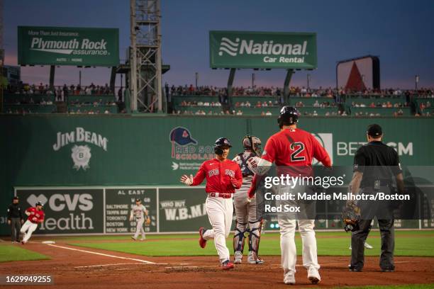 Masataka Yoshida of the Boston Red Sox scores on a double hit by Triston Casas of the Boston Red Sox during the first inning of a game against the...