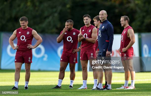 Steve Borthwick, the England head coach looks on with his players during the England training session held at Pennyhill Park on August 21, 2023 in...