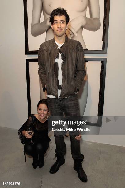 Model Hannah Doersken and Nick Simmons attend the Samuel Bayer Ace Gallery Exhibit Opening, presented by Panavision at Ace Gallery on March 2, 2013...