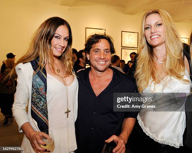 Celi, Samuel Bayer and Susan McKagen attend the Samuel Bayer Ace Gallery Exhibit Opening, presented by Panavision at Ace Gallery on March 2, 2013 in...