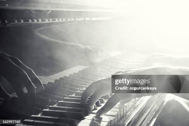 reflection of hand playing the piano - jazz piano stock pictures, royalty-free photos & images