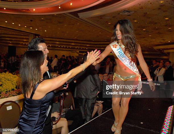 Rain Cosmetics Co-Founder Lisa Montoya and Rain Cosmetics CEO Ron Montoya congratulate Kayla Fitzgerald of Florida as she competes in the third...