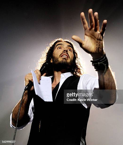 Comedian Russell Brand introduces singer Morrissey at Hollywood High School on March 2, 2013 in Los Angeles, California.